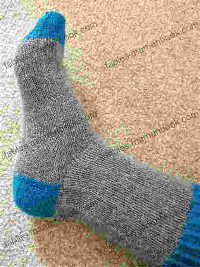 A Pair Of Two Tone Knitted Socks, Featuring A Contrasting Heel And Toe Adult Two Tone Sock Knitting Pattern: Intermediate Skill Level